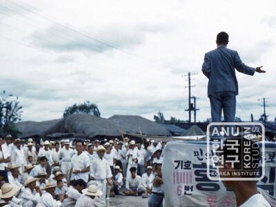 Crowd gathers at political rally, 1960