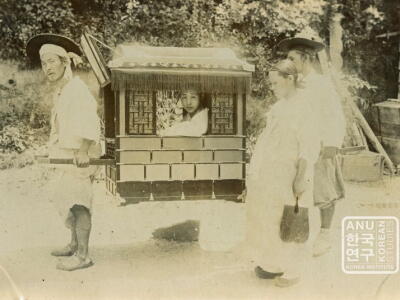 Young lady in palanquin in 1900s